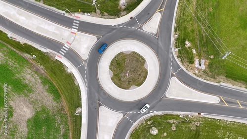 Two cars on a roundabout in ruarl USA. photo