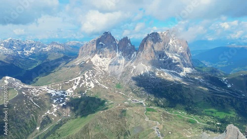 Italy dolomites natural park sella pass surroundings mountainsa and clouds 4k video with drone photo