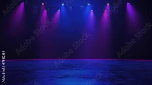 Empty stage illuminated by blue and purple lights in a dark theater