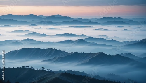 mountain layers and sunrise view in cold and foggy weather. © abu