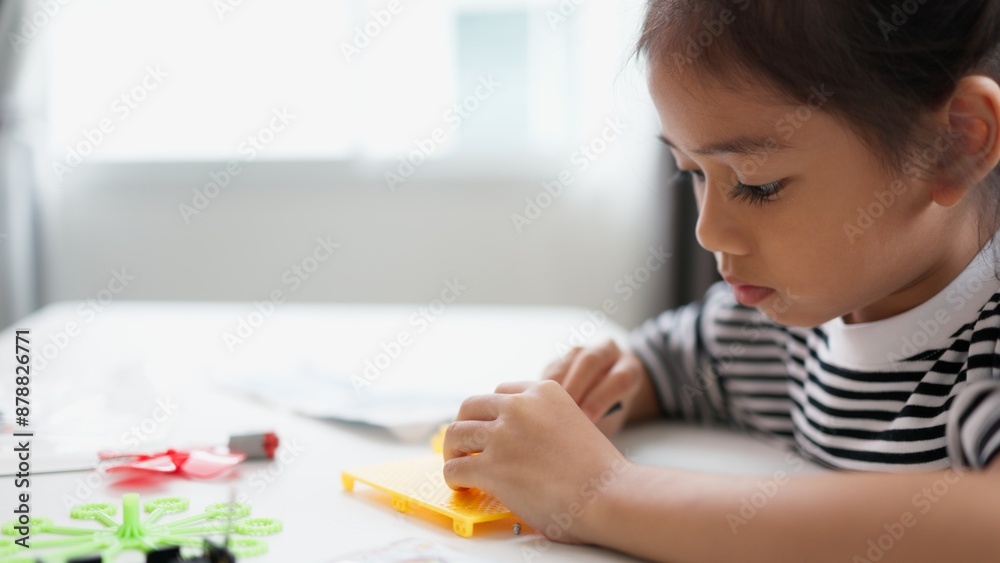 STEM education concept. Asian students learn at home with STEM toys, mathematics engineering science technology computer code in robotics for kids' concepts. STEM education concept. Asian students learn at home with STEM toys, mathematics engineering science technology computer code in robotics for kids' concepts.
