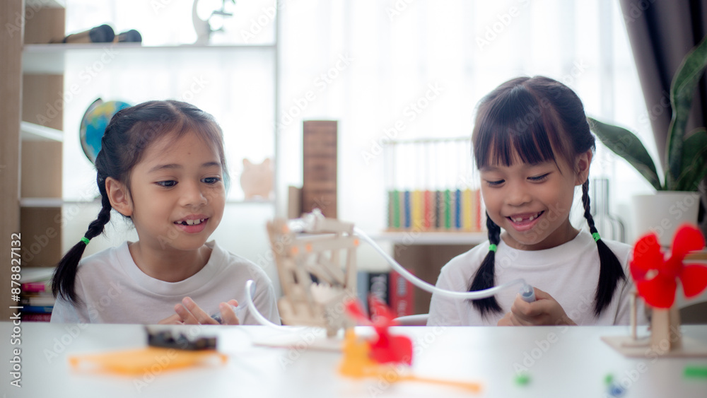 STEM education concept. Asian students learn at home with STEM toys, mathematics engineering science technology computer code in robotics for kids' concepts. STEM education concept. Asian students learn at home with STEM toys, mathematics engineering science technology computer code in robotics for kids' concepts.