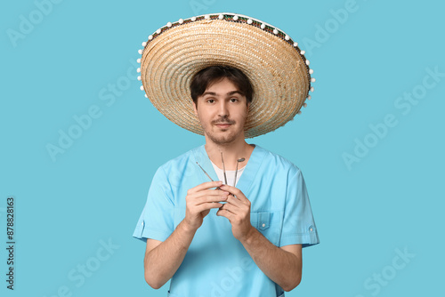 Young male dentist with som...