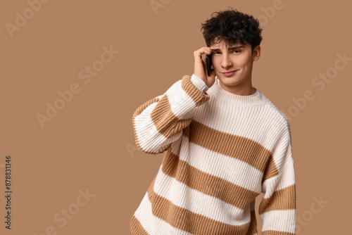 Young man engaged in phone ...