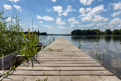 Pomost na plaży w słoneczny dzień Jezioro Lubie Zachodniopomorskie photo