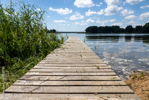 Pomost na plaży w słoneczny dzień Jezioro Lubie Zachodniopomorskie photo