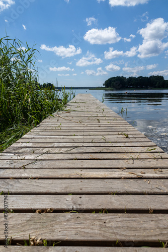 Pomost na plaży w słoneczny dzień Jezioro Lubie Zachodniopomorskie photo