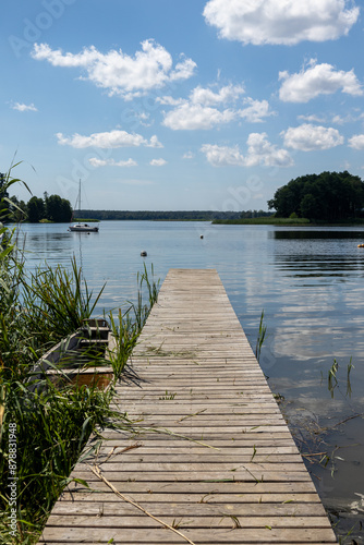 Pomost na plaży w słoneczny dzień Jezioro Lubie Zachodniopomorskie photo