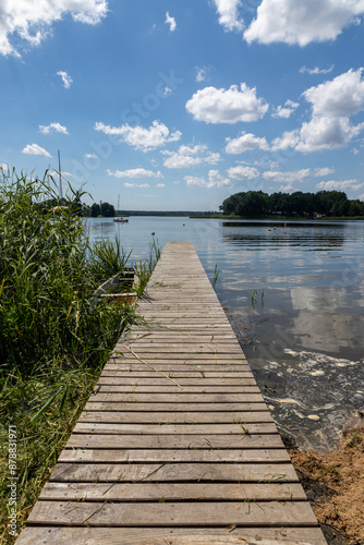 Pomost na plaży w słoneczny dzień Jezioro Lubie Zachodniopomorskie photo