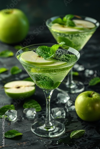 Refreshing Green Apple Mint Cocktail with Ice and Fresh Garnish in Martini Glasses.