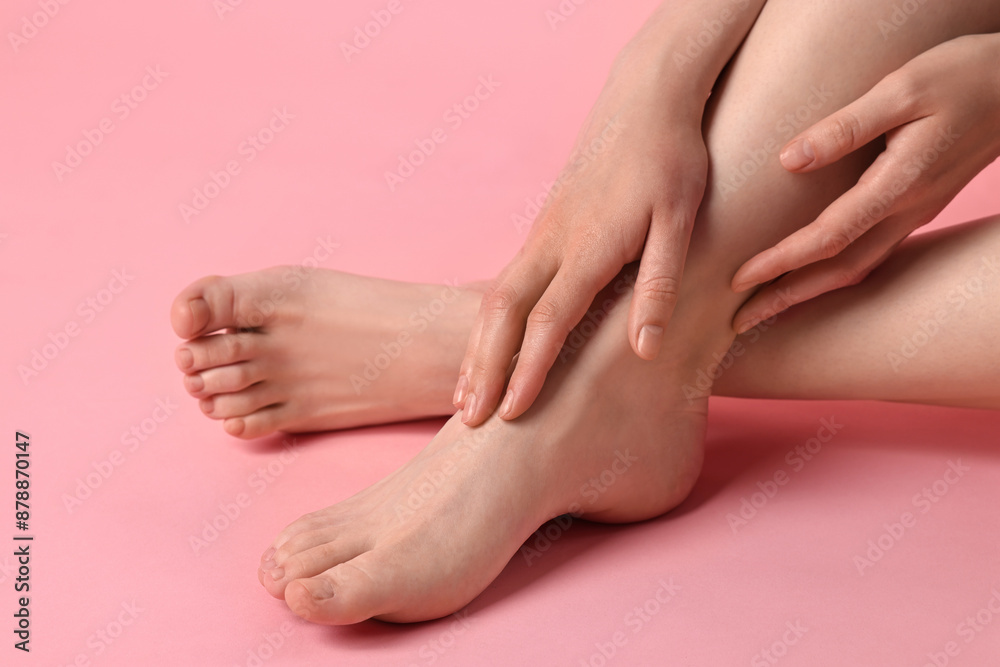 Closeup view of woman`s groomed feet after care procedure on pink background Closeup view of woman`s groomed feet after care procedure on pink background