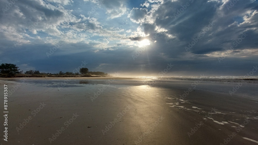 Stormy sky over the Sea. The sun's rays make their way through the clouds. Stormy sky over the Sea. The sun's rays make their way through the clouds.