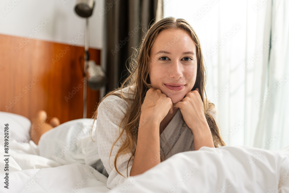 Portrait of Caucasian young girl in pajamas smile and look at camera. Portrait of Caucasian young girl in pajamas smile and look at camera.
