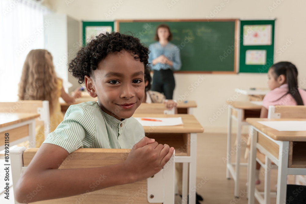 Portrait of African American schoolboy learning in classroom at school. Portrait of African American schoolboy learning in classroom at school.