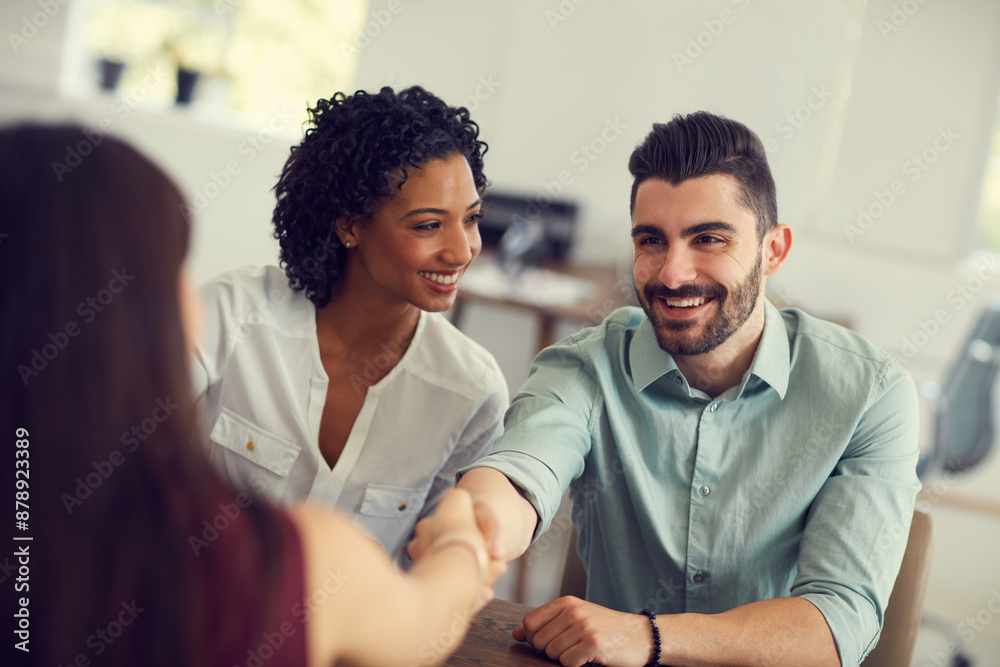 Fototapeta premium Office, meeting and couple with handshake in agreement for financial deal, negotiation and consultation. Happy, woman and man with hand gesture at bank for loan approval, investment and insurance