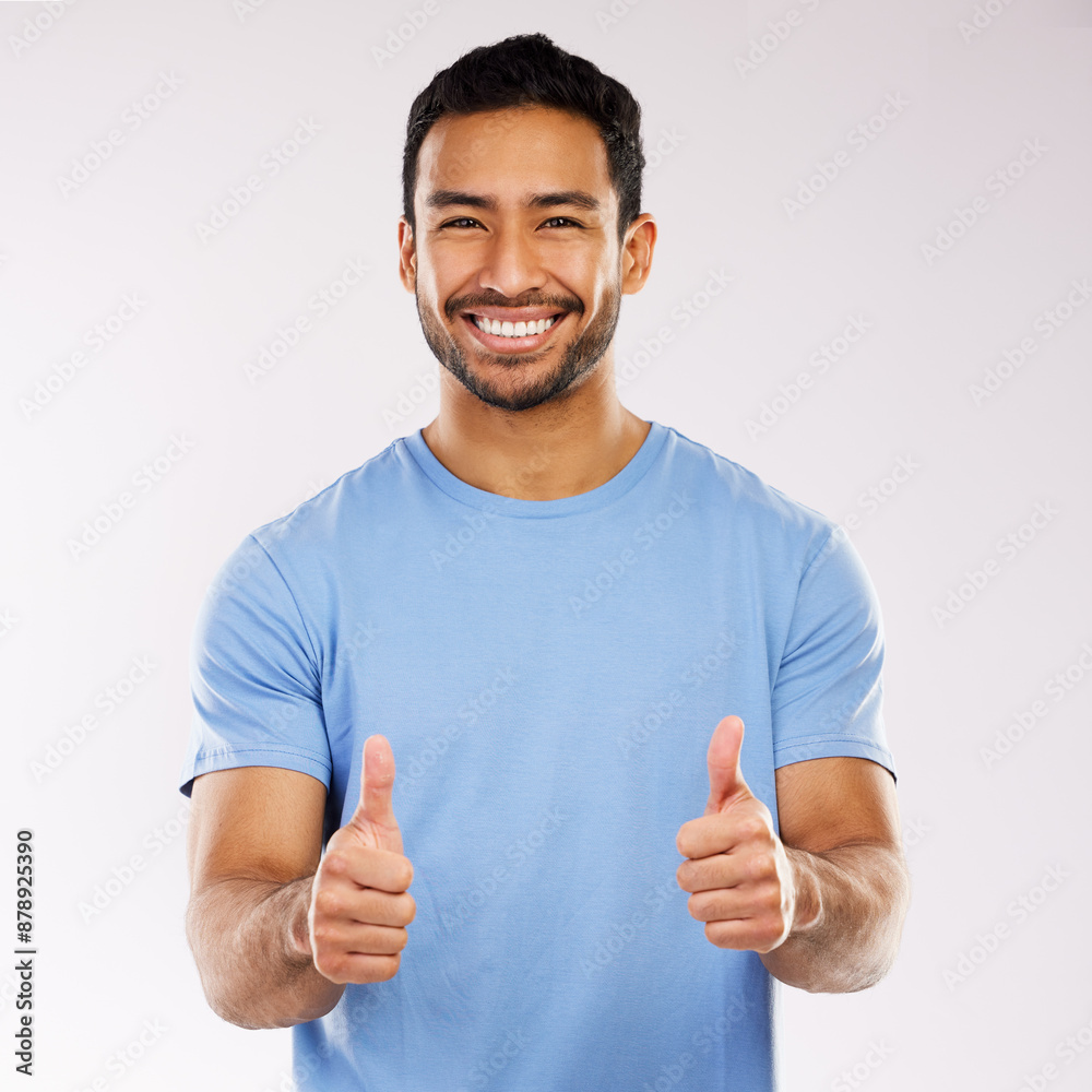 Thumbs up, smile and asian man in studio, hand gesture and emoji on white background. Thank you, yes and agreement for male person, portrait and happy face for approval and positive feedback or vote Thumbs up, smile and asian man in studio, hand gesture and emoji on white background. Thank you, yes and agreement for male person, portrait and happy face for approval and positive feedback or vote