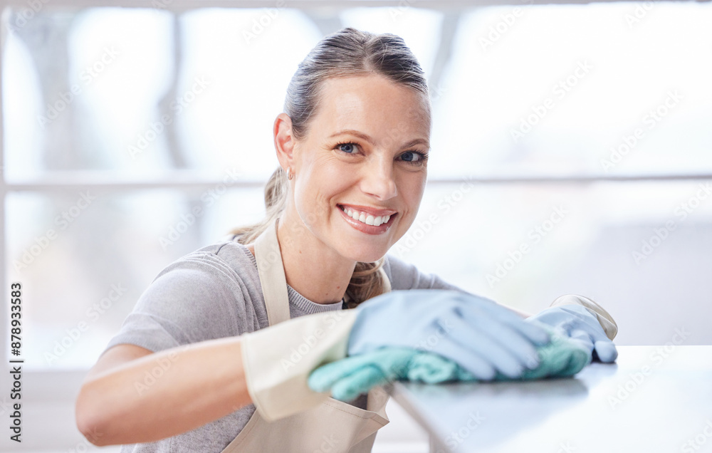 Hygiene, portrait and woman wipe kitchen counter with cloth for cleaning, remove bacteria or chores. Smile, sanitizer and person with spray bottle for housekeeping, detergent or disinfect in home Hygiene, portrait and woman wipe kitchen counter with cloth for cleaning, remove bacteria or chores. Smile, sanitizer and person with spray bottle for housekeeping, detergent or disinfect in home