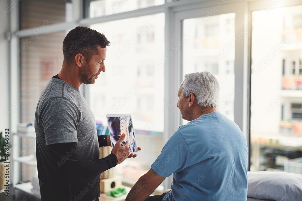 Obraz premium Senior, man and tablet in physio with x ray consultation for joint injury, healing advice and treatment planning. Rehab, elderly person or chiropractor on digital technology for patient muscle health
