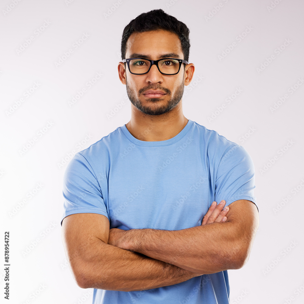 Crossed arms, glasses and portrait of man in studio with pride for web development career. Serious, IT and male programmer from Indonesia with confidence for vision or eyewear by white background. Crossed arms, glasses and portrait of man in studio with pride for web development career. Serious, IT and male programmer from Indonesia with confidence for vision or eyewear by white background.
