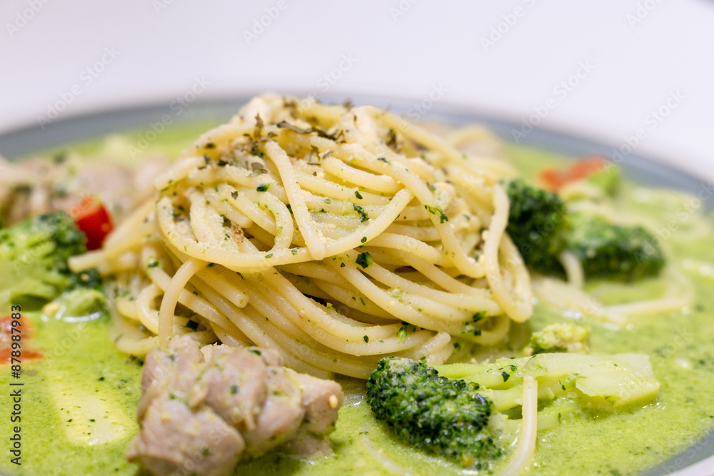 delicious pesto pasta, featuring a rich, green basil pesto sauce. The dish is beautifully presented with fresh ingredients, offering a flavorful and savory experience delicious pesto pasta, featuring a rich, green basil pesto sauce. The dish is beautifully presented with fresh ingredients, offering a flavorful and savory experience