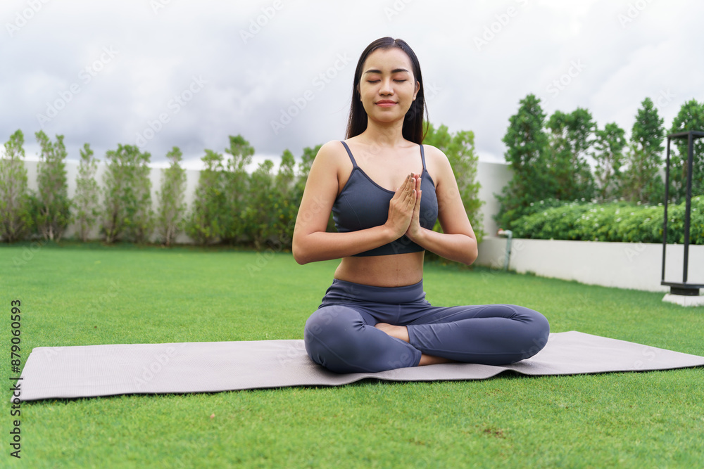 Beautiful confident asian woman practices yoga in green park relax in nature. Portrait Asian girl do serene sincere peaceful in morning park sportswoman wellness health Beautiful confident asian woman practices yoga in green park relax in nature. Portrait Asian girl do serene sincere peaceful in morning park sportswoman wellness health