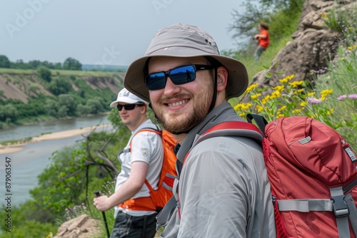 Happy hikers enjoying a scenic river view © JCarlos VBrito