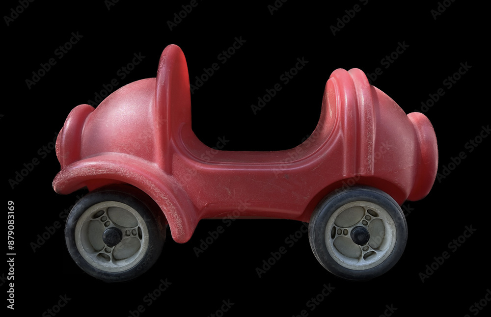 Children's pedal toy car on playground, close-up photo. Children's pedal toy car on playground, close-up photo.