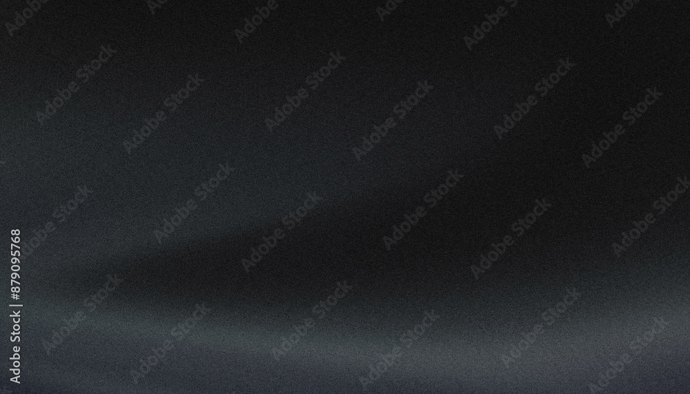 Dark background with grainy texture and a smooth lighting gradient Dark background with grainy texture and a smooth lighting gradient