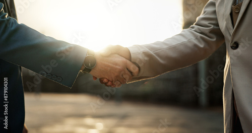 Closeup, handshake and business people in city, agreement and partnership with welcome, introduction and collaboration. New York, men and employees shaking hands for offer, promotion and cooperation