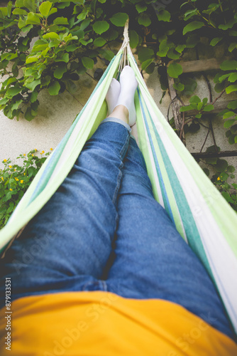 Lgs of woman relaxing in hammock photo