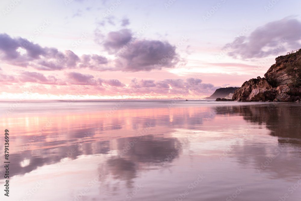 Pastel pink sunset at beach reflecting off sand, Gold Coast Pastel pink sunset at beach reflecting off sand, Gold Coast