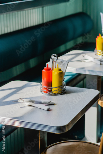 ketchup and mustard on table in diner