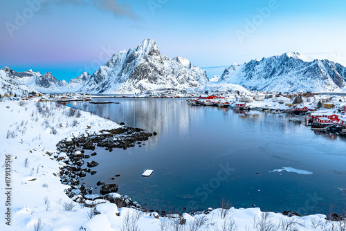 Snowy fishing village of Reine at dawn, Lofoten Island, Norway photo
