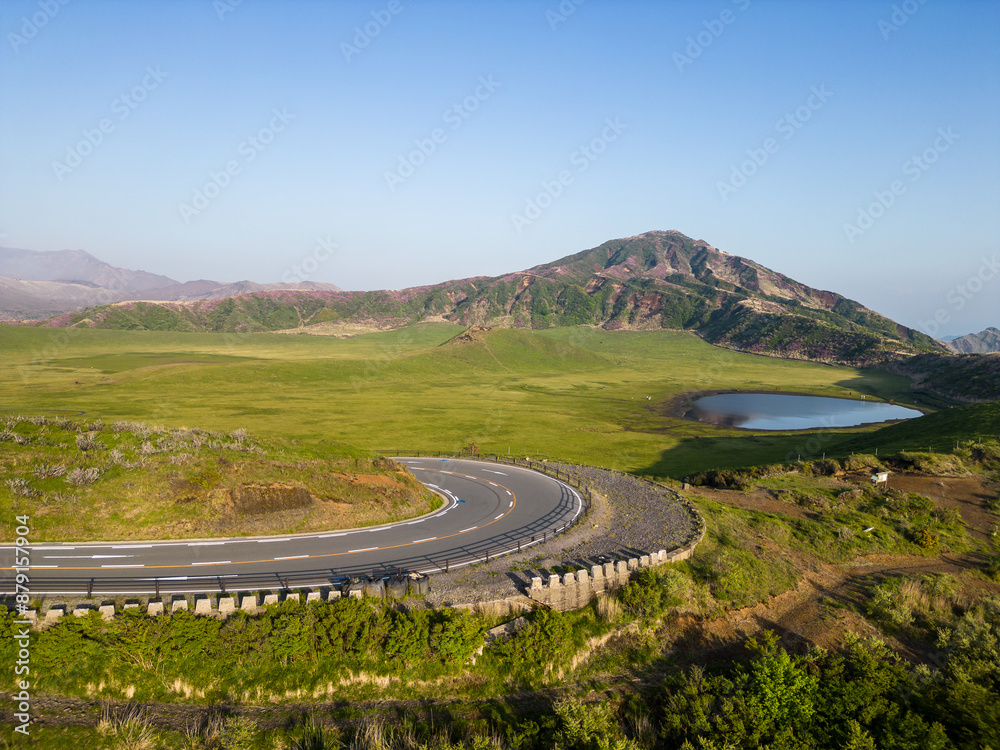 Φωτογραφία Mt Aso, Japan: Aerial view of the road leading to  Mt Aso volcano with the Eboshi crater in the in springtime near Kumamoto in Kyushu in Japan