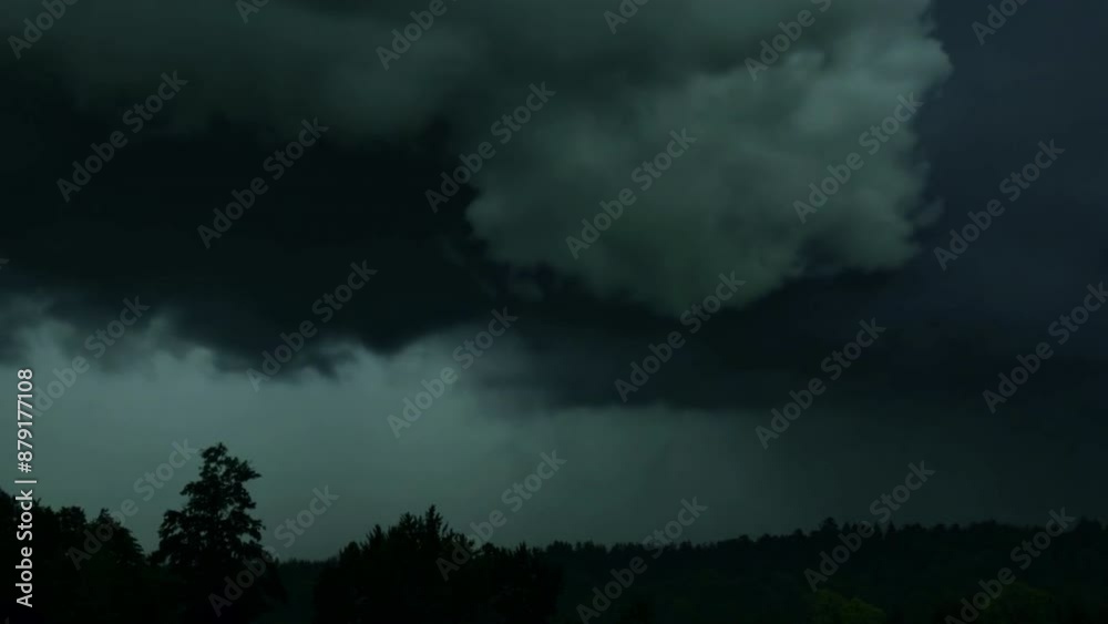 Black dark greenish blue dramatic night sky. Gloomy ominous storm rain clouds background. Cloudy thunderstorm hurricane wind lightning. Epic fantasy mystic. Or creepy spooky nightmare horror concept. Black dark greenish blue dramatic night sky. Gloomy ominous storm rain clouds background. Cloudy thunderstorm hurricane wind lightning. Epic fantasy mystic. Or creepy spooky nightmare horror concept.