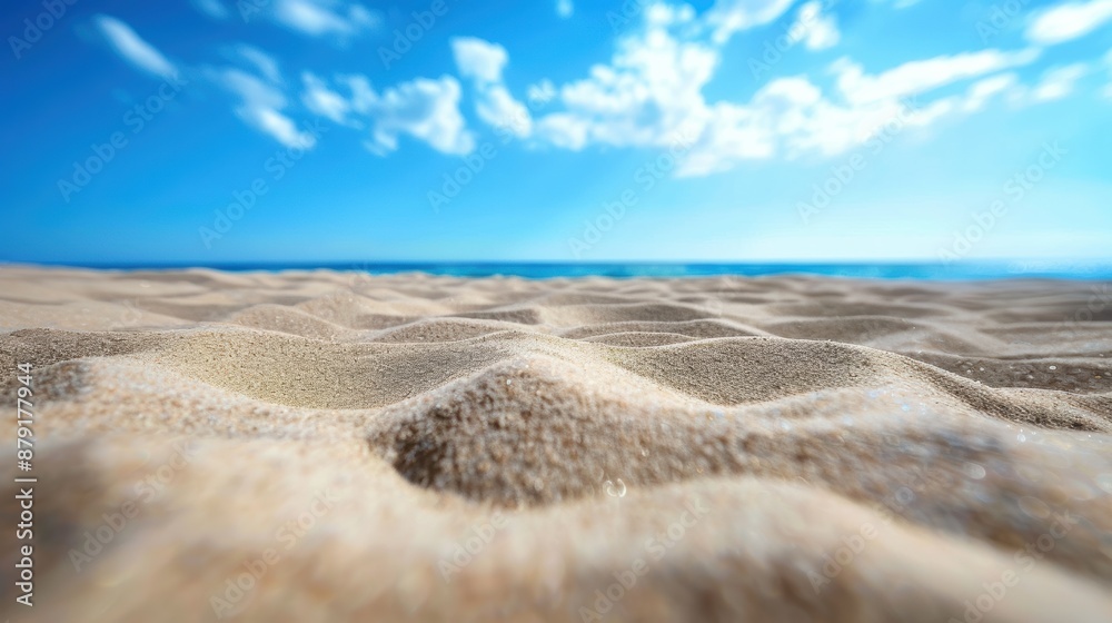 Closeup of sand on beach and blue summer sky Closeup of sand on beach and blue summer sky