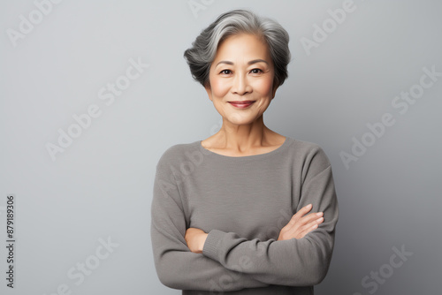 portrait of a asian mature woman on white background
