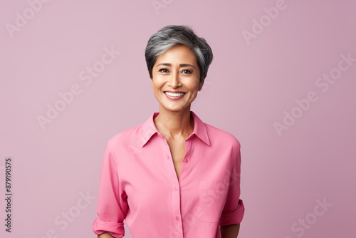 happy mature businesswoman in pink shirt