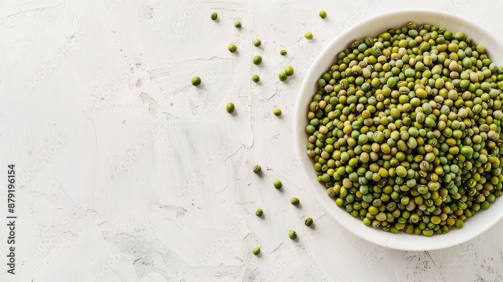 Mung beans in white bowl on white background with space for text Mung beans in white bowl on white background with space for text