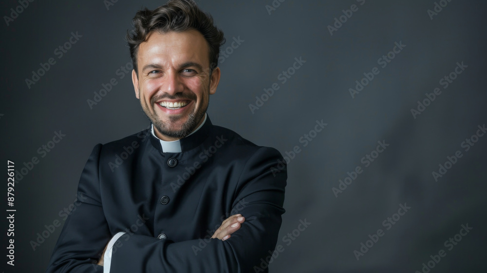 A man in a black suit and a white collar is smiling A man in a black suit and a white collar is smiling