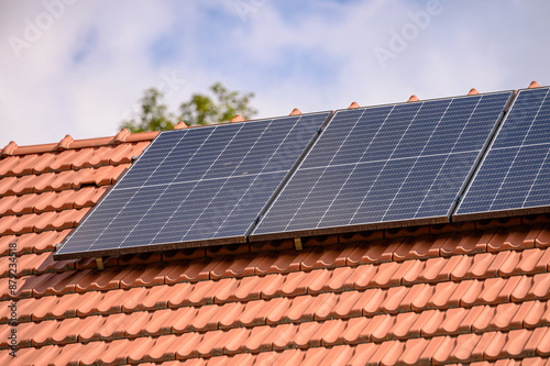 Solar Panels on a Tiled Roof, renewable energy, sustainable living.