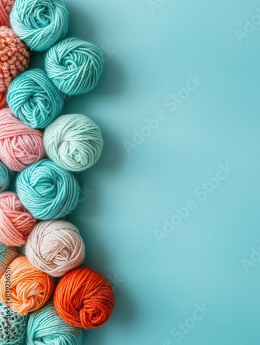 Flat lay of knitting yarn on pastel blue background, cozy craft minimalism, with plenty of room for creative expression.