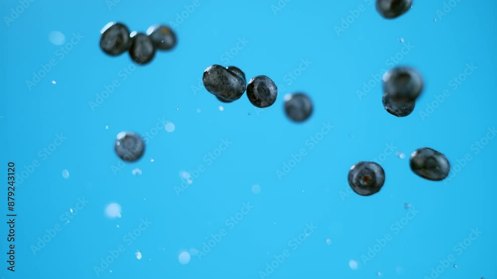 Exploding Blueberry Explosion of blueberries and water with single berry in focus. High ...