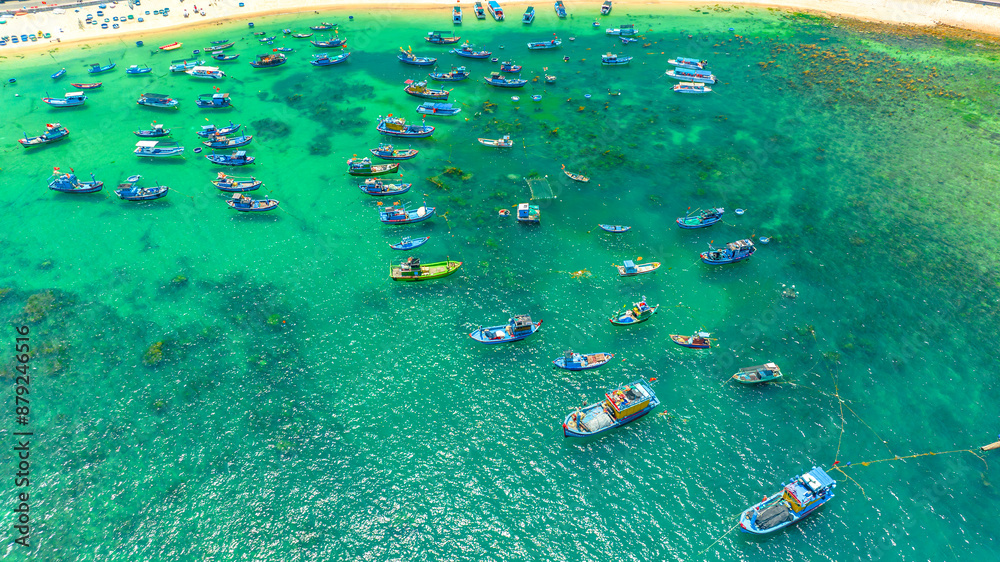 Fototapeta premium Fishermen's boats moored in Nhon Hai sea, Binh Dinh province, Vietnam. View from above