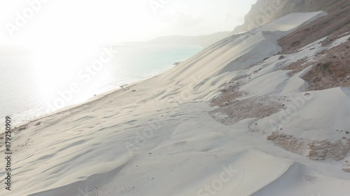 White sand dunes in the coast of archer beach at sunrise, Socotra island photo