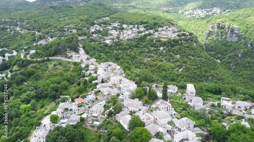 Papigo Aerial Pull Back Shot, Zagorochoria Greece Village Reveal, Stone Made Houses Traditional Housing Development photo