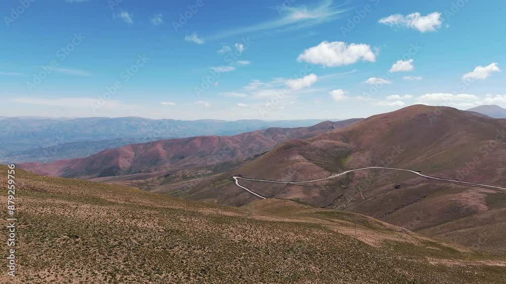 Aerial establishing shot of a windy road running through the Andean Mountains Aerial establishing shot of a windy road running through the Andean Mountains