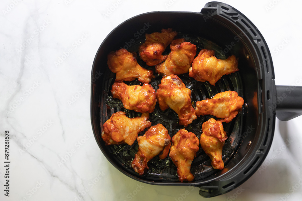 Fototapeta premium Tasty roasted chicken wings. Delicious and easy meals from air fryer.