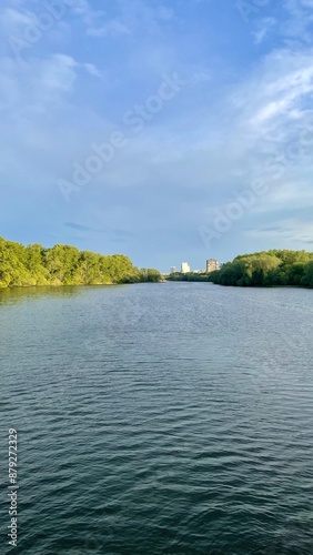 A landscape with a view of the river and the sunset