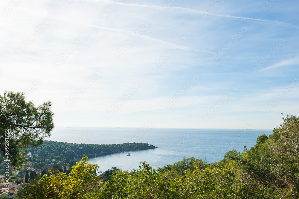 Scenic view of Buyukada Island in Istanbul, with lush green hills, houses, and the sea in the background Scenic view of Buyukada Island in Istanbul, with lush green hills, houses, and the sea in the background